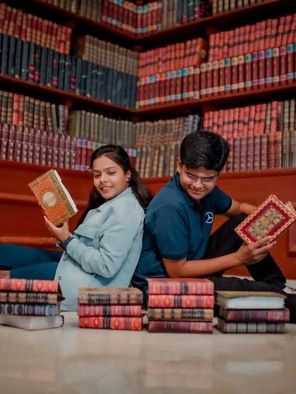 For the book-loving couple, a library-themed pre-wedding shoot is a perfect match. Here they are, sitting back-to-back amidst stacks of books, lost in their own stories.