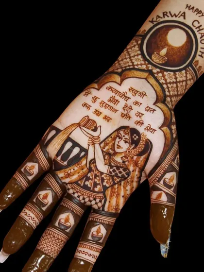 A classic Karwa Chauth design featuring a woman performing the ritual of offering water to the moon. The Hindi text and diya patterns on the fingers complete the festive look.