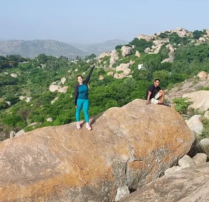 Enjoying the freedom and the view from a large boulder at Anthargange.