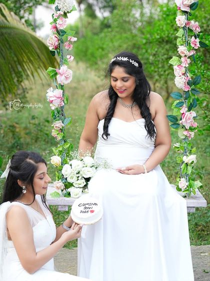 A lovely portrait of friends on our floral swing, holding a "Coming Soon" sign. A beautiful way to include loved ones in your announcement.