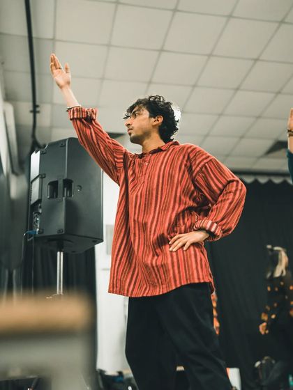 A candid shot captured during a 'Raanjhanaa' workshop. A moment of focus and emotion before the movement begins.