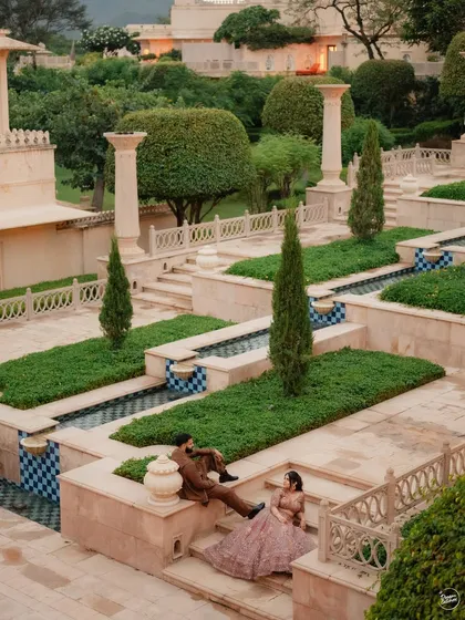 For the couple that dreams of a fairytale, we create royal portraits against the grand architecture of Udaipur. This wide shot at The Oberoi Udaivilas showcases the scale and elegance we can bring to a luxury pre-wedding photoshoot.