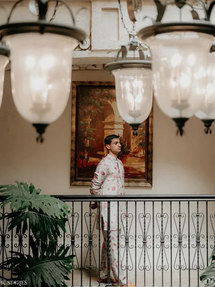 A portrait of the groom, Shafeen, at his Austin wedding. The composition, using the architectural elements of the Villa Antonia, creates a sense of depth and classic style.