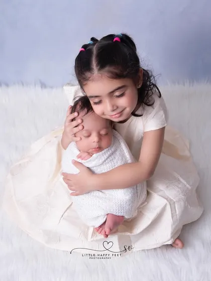 The moment a big sister meets her new best friend is priceless. I always encourage including siblings and family in the session. These are the portraits that tell the story of your growing family and the beautiful bonds being formed.