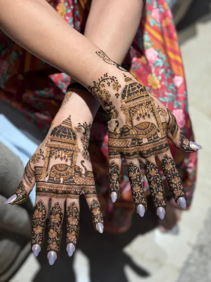 A beautiful Karwachauth design featuring traditional palanquin and elephant motifs.