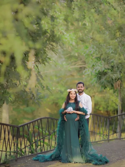 A lovely portrait of a couple on a bridge, surrounded by nature. This pose is perfect for capturing both the couple and the beautiful scenery.