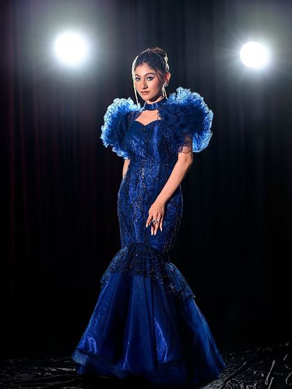 A full-length shot of the stunning blue mermaid gown.