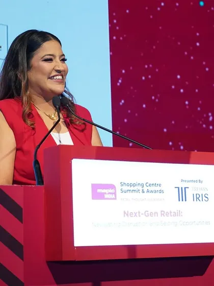 A smiling shot from the podium. A positive and warm demeanor is essential for a successful corporate host.