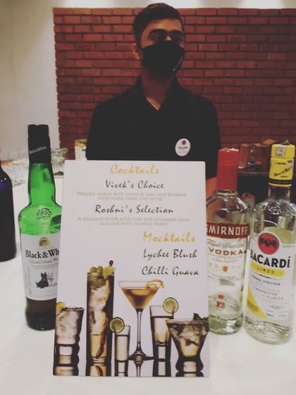 Personalization is key to our wedding service. This custom bar menu features signature cocktails named after the bride and groom, 'Vivek's Choice' and 'Roshni's Selection', alongside our popular mocktails.