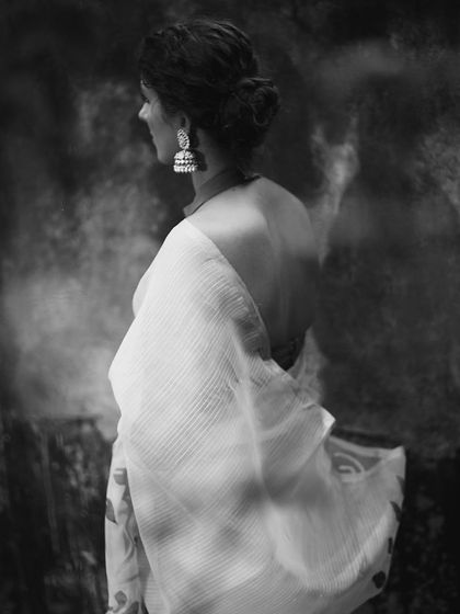 The same look as the previous image, translated into a dramatic black and white composition. This version highlights the contrast and texture, turning the photograph into a piece of timeless art.