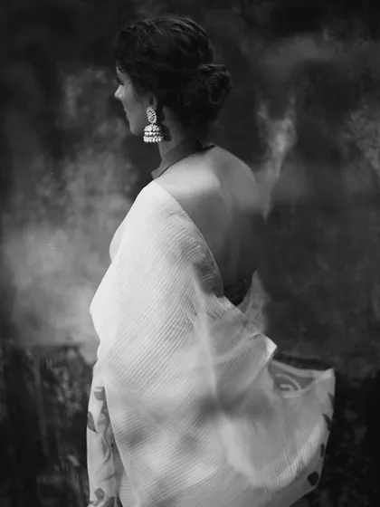 The same look as the previous image, translated into a dramatic black and white composition. This version highlights the contrast and texture, turning the photograph into a piece of timeless art.