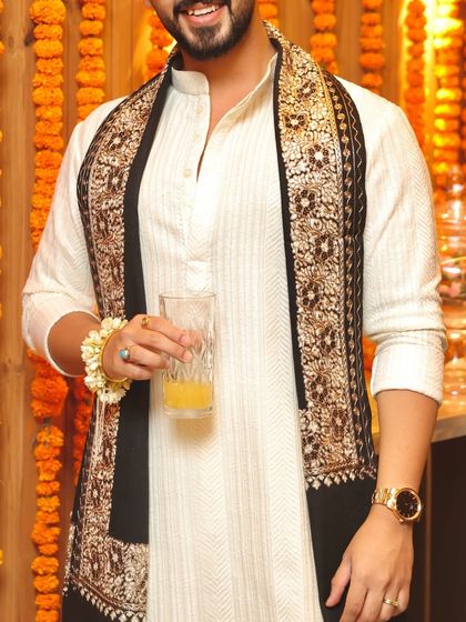 A closer view of the detailed embroidery on the black stole, showcasing the fine craftsmanship.