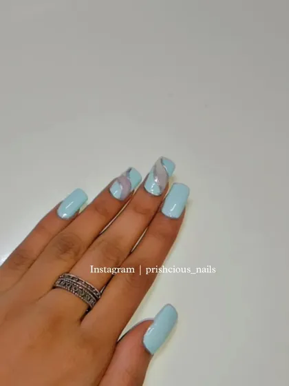 A final look at this serene and dreamy light blue manicure.