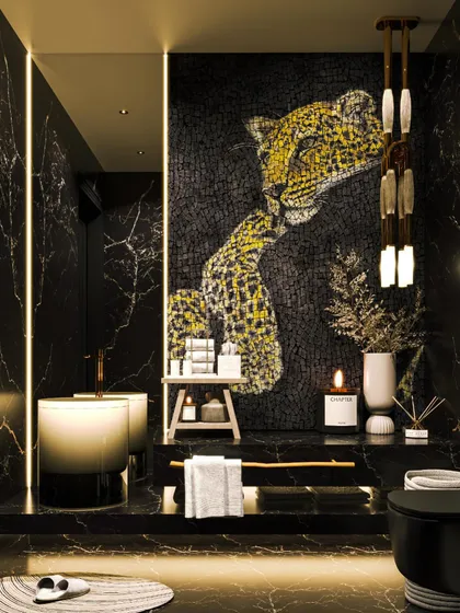 For this powder bathroom, we embraced a bold and dramatic theme. The space is enveloped in black Marquina marble, with a custom leopard mosaic art piece serving as a stunning focal point, demonstrating our ability to integrate bespoke art into our designs.