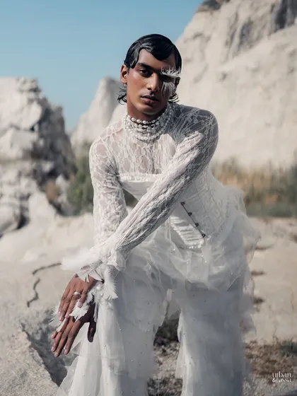 This high-fashion look features dramatic white feather accents around the eye, creating a wing-like effect. I kept the rest of the makeup minimal to draw all attention to the textural details and paired it with a sleek, wet-look hairstyle.