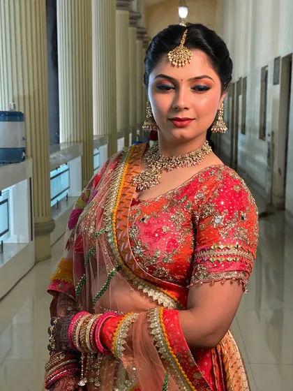 A close-up of the Garba night makeup. The blue-toned eyeshadow adds a unique touch, complementing the colourful embroidery of her chaniya choli.