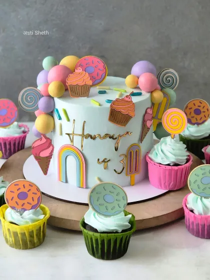 Welcome to Candy Land! This colorful themed cake is my bestselling Chocolate Mousse flavor, decorated entirely with whipped cream and edible toppers to match the party decor. It’s a fun, non-fondant option for children's birthdays.