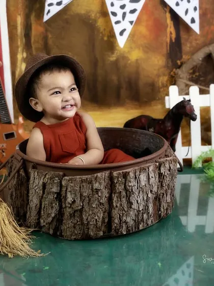 A big, joyful smile from our little cowboy. His happiness is what makes these themed shoots so special.