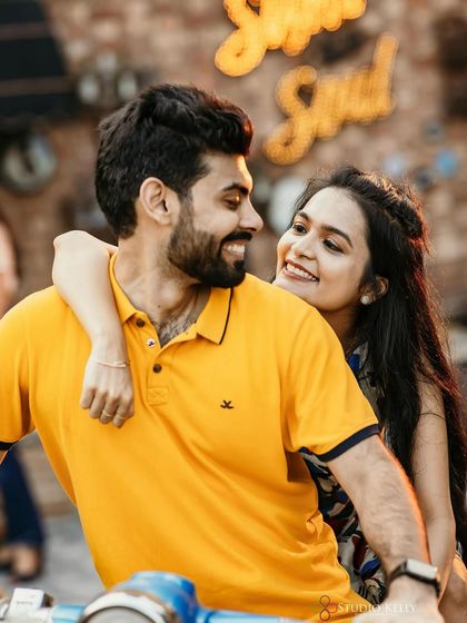 A cute shot on a scooter. The makeup is clean and simple, perfect for this fun and retro-inspired pre-wedding theme.