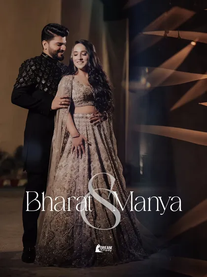 A full-length portrait of Bharat and Manya, showcasing their elegant, coordinated outfits for their Sagan ceremony.
