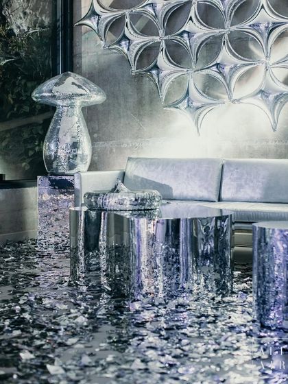 This lounge area captures the essence of 'The Melting Disco Ball'. The space is a symphony of silver, with reflective tables, metallic confetti, and a unique wall installation, all designed to transport guests to an extraordinary, glittering dimension.