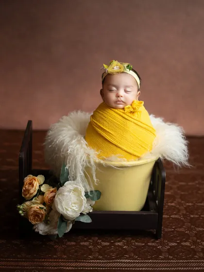 A wider view of the yellow-themed setup, showing the delicate floral arrangement that complements the scene.