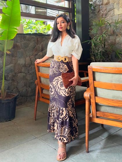 A full-length shot showing the fishtail silhouette of the skirt. It's a unique and flattering cut.