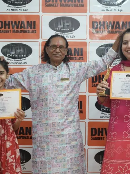 An adult student and her daughter, both winners, with our senior guru.