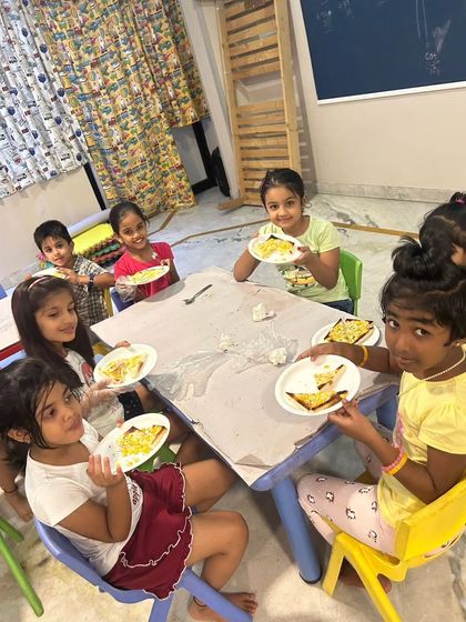 Kids enjoying the delicious and healthy snacks they made themselves during a fireless cooking session at our summer camp.