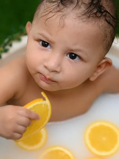A playful and unique baby photoshoot featuring a fun citrus milk bath. I love creating adorable and memorable portraits of your little ones as they grow.