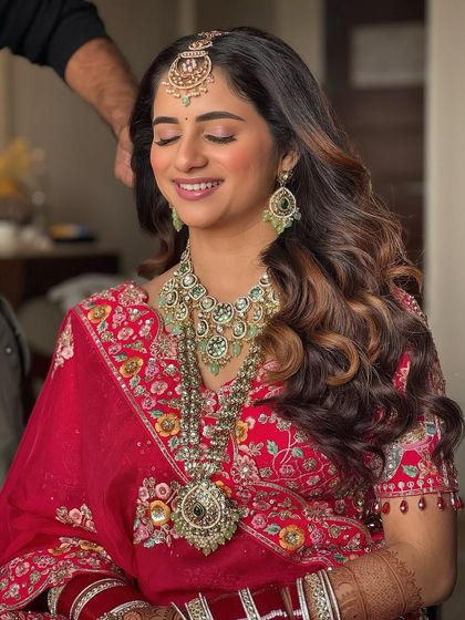 The bride with her eyes closed, showcasing the soft and beautiful eye makeup. The look is minimal yet impactful, perfect for a modern bride.