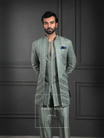 In the calmness of sage green lies a quiet grandeur. This ensemble is tailored to perfection, with a structured silhouette that flows effortlessly, exuding timeless sophistication.