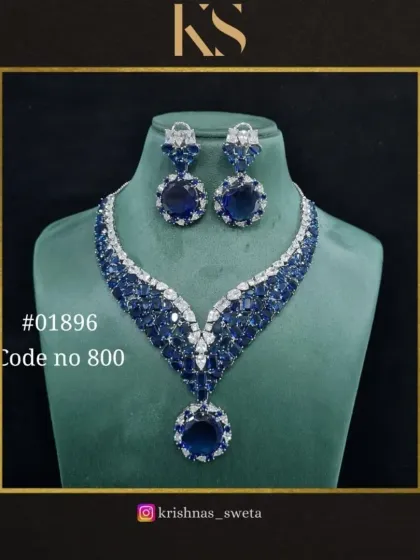 A premium quality American diamond set in a striking sapphire blue. The V-shaped necklace with a large pendant is a glamorous choice for any evening event.
