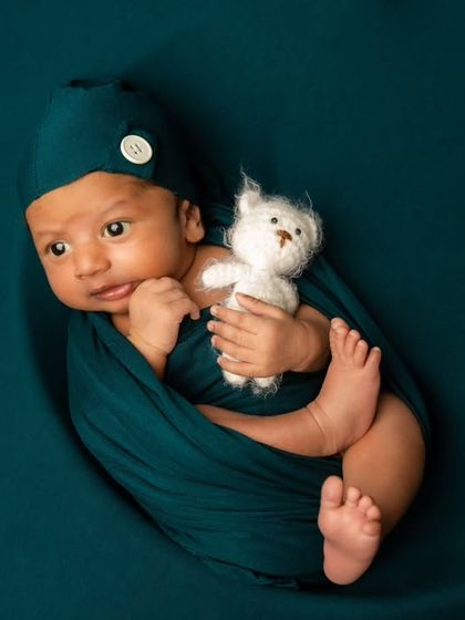 Another adorable shot of our awake moon baby, this time with a curious expression, highlighting the different moods of a newborn.