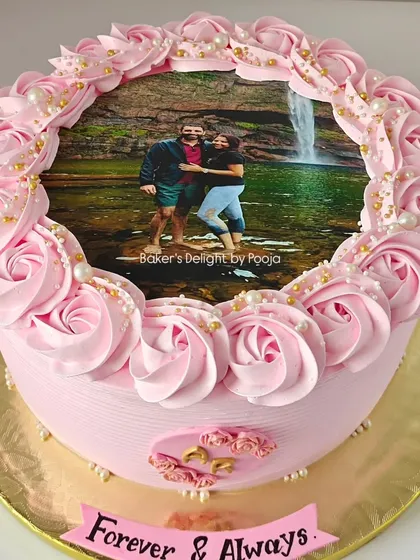 A simple photo cake transformed into a showstopper for a pre-wedding party. This 3kg pink perfection features the couple's photo surrounded by beautiful buttercream rosettes and pearls.