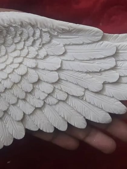 A different angle showcasing the beautiful, detailed texture of a cast made from my handmade angel wing mold. The quality of the mold ensures every feather is perfectly defined.