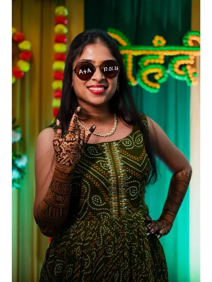The bride looking cool and happy in her custom sunglasses at her mehendi party. It's all about capturing the personality of the day.