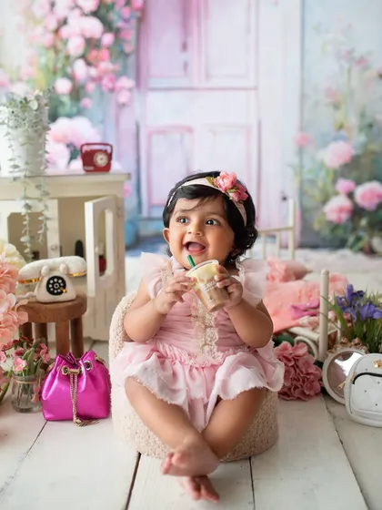 This chic little bub is enjoying her "coffee" in a beautiful pink floral setup. I love combining themes to create something truly unique for each client.