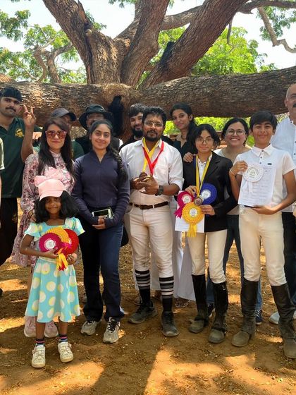 The REA family celebrating a day of wins. The support from parents, grooms, and fellow riders is the secret ingredient to our success.