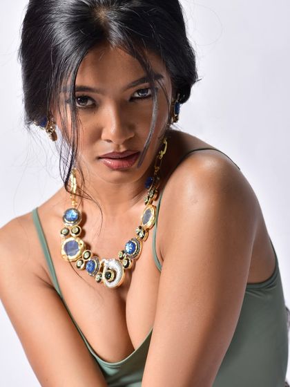 A classic, alluring beauty shot that puts the jewelry front and center. The model's pose and direct gaze are confident and captivating, making the jewelry feel aspirational and desirable.