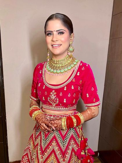 A close-up portrait without the dupatta, focusing on the clean makeup and sleek hair that frames her face beautifully.