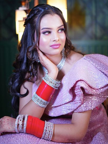 A close-up on the bridal choora and the ruffled shoulder detail.