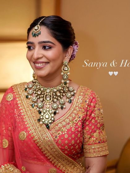 A portrait of Sanya, capturing her warm smile and the soft, semi-matte makeup that enhanced her natural glow.