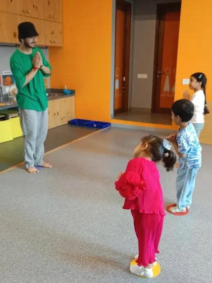 Our instructors begin each class by connecting with the students, often with a simple 'namaste', creating a respectful and focused learning environment.
