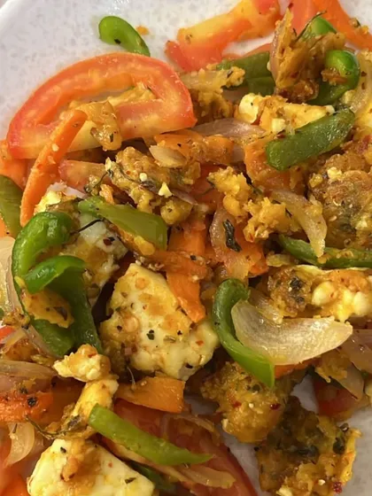 A colorful and protein-rich paneer stir-fry with fresh tomatoes, onions, and bell peppers. Healthy eating can and should be delicious and visually appealing.