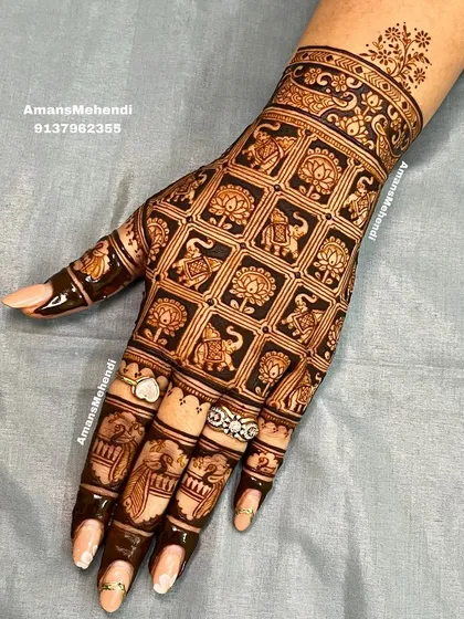A modern take on traditional motifs, this back-of-hand design features a clean grid pattern. Each square is filled with alternating elephant and lotus symbols, creating a look that is both contemporary and classic.