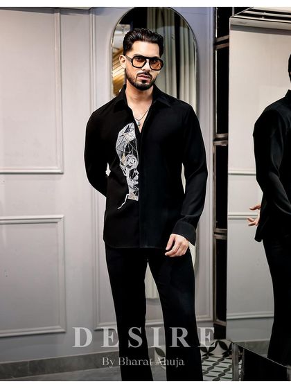 Another full-length view of the abstract face shirt, a piece that is a true statement of individuality.