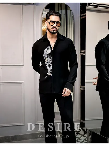 Another full-length view of the abstract face shirt, a piece that is a true statement of individuality.