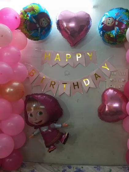 Another look at the Masha theme decoration, showing the heart-shaped foil balloons.