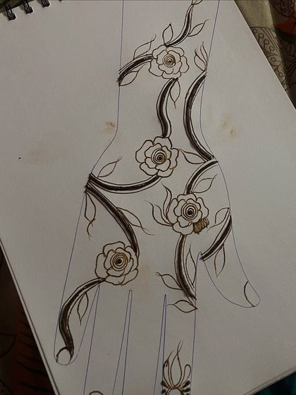 A sketch of a Gulf henna design, showing the planning that goes into creating these beautiful rose and vine patterns.